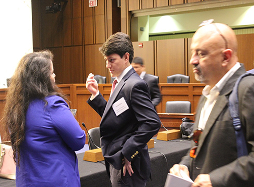 Michael Bates chats with colleagues